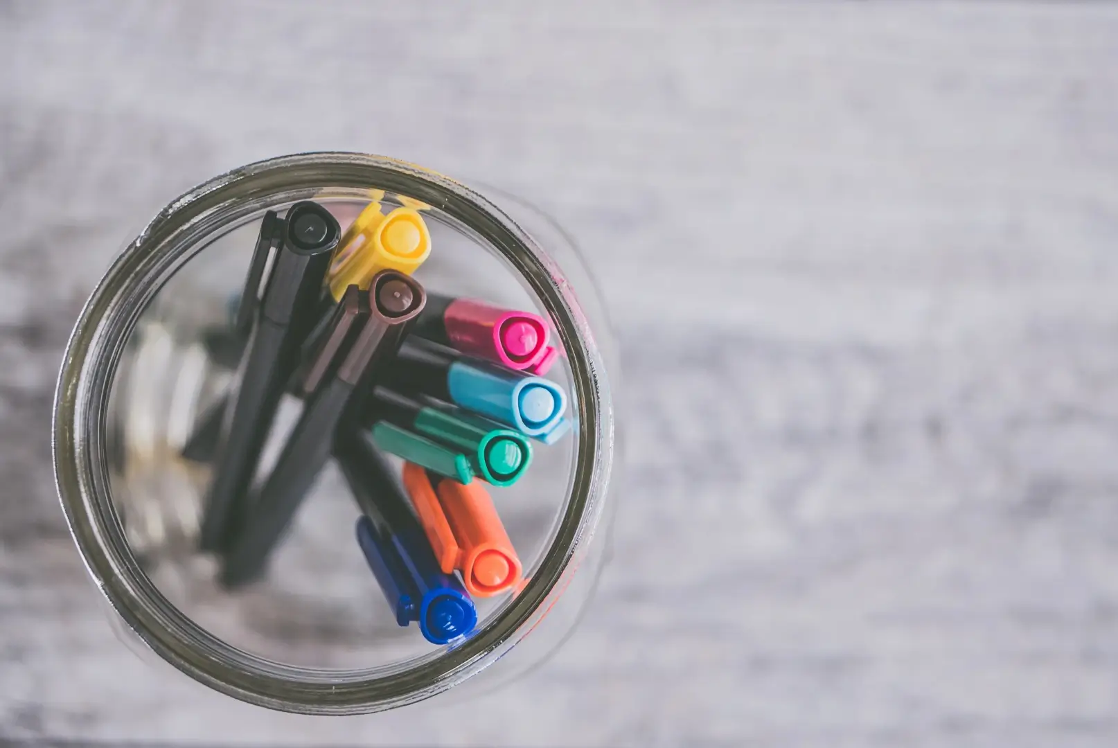 Top view of art supplies in a pot for creative therapy tools